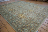 Peshawar carpet pattern with unique seafoam, blue, brown cameo medallions and motifs.