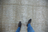 Lustrous simulated silk pile with abstract silver and powder blue patterns.