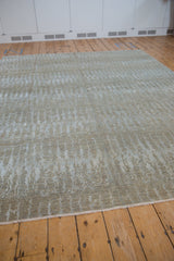 Lustrous simulated silk pile with abrashed field and contemporary vertical elements.