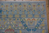 Close-up of geometric Persian-style patterns with silver, aqua, saffron yellow, and red colors.