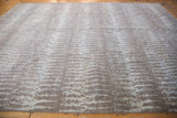 Soft, lustrous simulated silk pile with oxidized silver, powder blue elongated abrashed pattern.