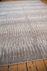 Lustrous abrashed pile with elongated silver patterns on a contemporary Pakistani rug.