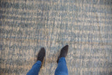 Contemporary Pakistani rug's striated pile, featuring ivory, powder blue, and slate blue underfoot.