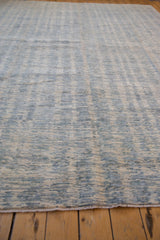 Ivory and blue striated abrash pattern, showing plush pile and intact side selvage.