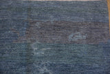 Contemporary Pakistani carpet showing cloud-like watery formations, dusty blues, and art silk sheen.