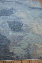 Cloud-like watery pattern of silver, dusty blue, and ivory art silk accents.