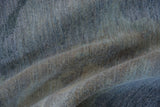 Close view of the hand-knotted pile, showing cloud-like blue and silver color variations with art silk sheen.