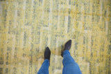 Pakistani Contemporary rug with feet, highlighting pale saffron and silver geometric patterns.