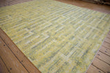 Stepped geometric pattern in pale saffron yellow, silver, and ivory with art silk accents.