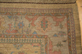 Vintage Indian Soumac rug corner, blush floral motifs, sea foam pawn design, and fringe.