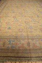 Vintage Indian Soumac rug's main border featuring arabesque lotus and pawn motifs in pastel tones.