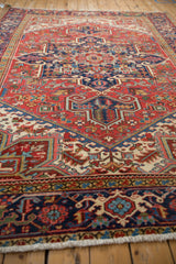 Low-angle perspective of a vintage Heriz carpet showing its even pile and intricate geometric field.