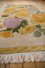 Thick plush ivory pile, yellow serrated floral petals, aubergine checker motif, and fringe.