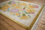 Ivory fringe and striped yellow narrow border on a vintage Indian Art Deco rug.