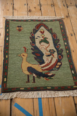 Original ivory fringe, jade green field, and thin banded border of a vintage Armenian rug.