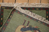 Corner detail of the full hand-knotted pile, tight weave backing, and ivory fringe.
