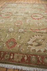 Detailed pattern of vintage Armenian Sultanabad carpet with sage, copper, and ivory palmettes.