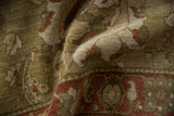 Folded vintage Sultanabad rug with full pile, sage green palmettes, and copper vines.