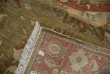Armenian Sultanabad rug corner showing sage green floral pile, ivory fringe, and hand-knotted reverse.