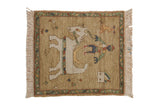 Beige vintage pictorial Armenian rug featuring horse, trainer, flowers, and vine-and-bud border.