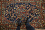 The plush, full pile of a vintage Armenian rug with a navy blue floral field.