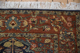 Intact navy blue side cord and clean white fringe on the corner of a vintage Hamadan design rug.