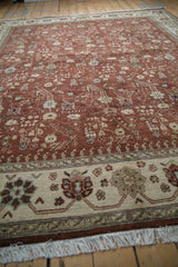 Full wool pile of a vintage Armenian carpet, showing the copper floral field and ivory border.