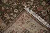 Corner view of the rug's intact selvage, hand-knotted back, and dense pile.