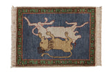 Vintage Armenian pictorial rug with lion and prey on dark denim blue field.