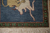 Emerald green geometric border and ivory fringe on a vintage pictorial Armenian rug.