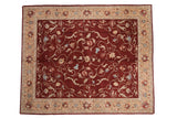 Vintage Armenian Arts and Crafts carpet with scrolling vinery on a wine red field and a sand floral border.