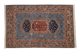 Vintage Armenian Hamadan design rug with a triple medallion, bird and plant motifs on a sky blue field.