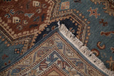 A folded corner of the Armenian rug shows its hand-knotted back, side cord, and clean fringe.