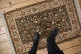 Vintage Armenian Hamadan rug with an olive green floral field, viewed from above to demonstrate scale.