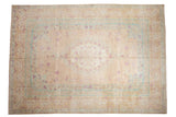 Distressed Bulgarian Kerman design carpet with an ivory field, powder blue accents, and magenta floral sprays.