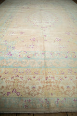 Angled view of a distressed vintage carpet highlighting its soft, low pile and even wear.