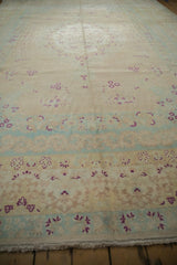 Low perspective view across the vintage carpet showing its even wear and speckled low pile.