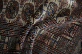 Soft, high-sheen pile and detailed gul medallions on a finely woven vintage Bokhara rug.