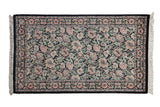 Vintage Pakistani Arts and Crafts rug: dense black ground with multi-petaled floral design.