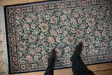 Arts and Crafts floral design with jade green, dusty rose, ivory on black.