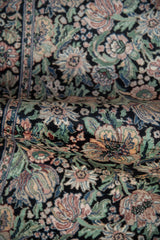 Detail of dense curvilinear floral pattern: multi-petaled flowers and vines in dusty rose, green, blue.