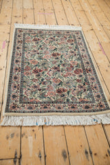 Ivory Pakistani Arts and Crafts rug border and dense floral pattern with full fringe.