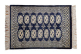 Vintage Bokhara rug mat, cobalt blue field, geometric guls with ivory and platinum borders.