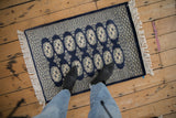 Vintage Bokhara rug mat with cobalt blue and ivory double column geometric gul.