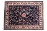 Vintage Pakistani Isfahan carpet, navy blue field, pointed roundel medallion, intricate floral vinery, ivory border.