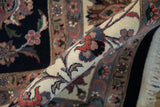 Detailed pile of the Isfahan rug showcasing blush, ivory, and slate blue vinery.