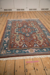 Vintage Indian Serapi rug corner, highlighting shallow carved contour and floral palmettes.