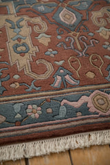 Detail of carved floral border, rose field pattern, and ivory fringe.