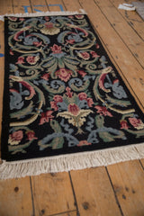 Hand-knotted looped pile Savonnerie rug, floral vines in black, denim blue, blush.