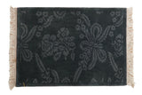 Vintage Indian rug in tonal denim blue with a carved design of rose blossoms and serrated leaves.